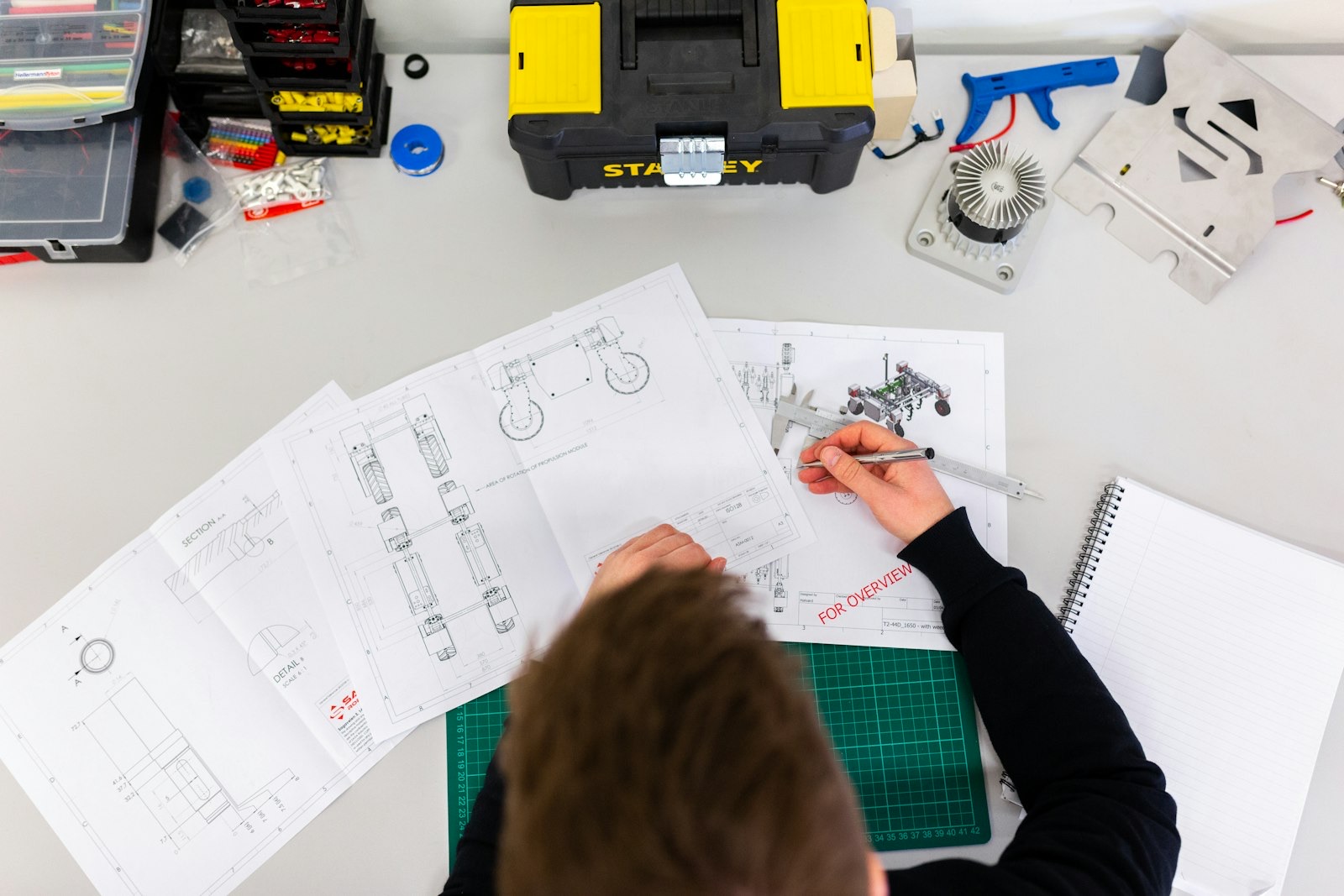 Engineer reviewing technical drawings during a GPR survey